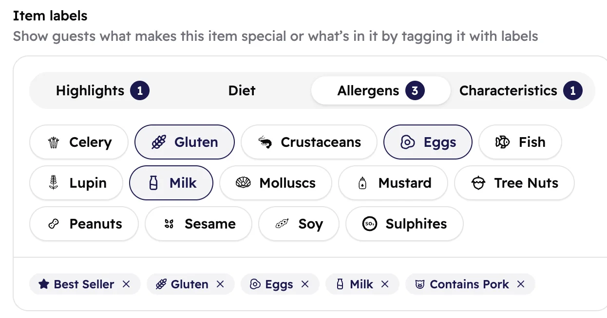 The Item labels box of Double Cheese Burger on the Allergens tab, with Gluten, Eggs and Milk picked, and Best Seller and Contains Pork in the list below.